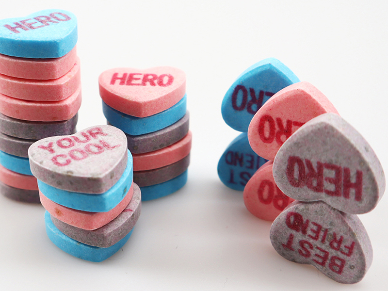 Close-up of heart-shaped Valentine candy showing glossy finish and consistent candy molding quality