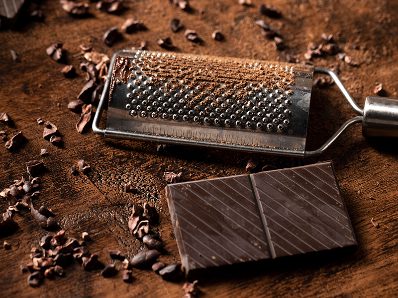 A man enjoying dark chocolate, highlighting its mood-boosting benefits.