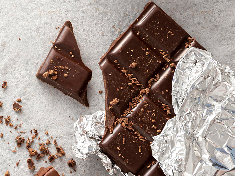A dark chocolate, representing its cardiovascular benefits.