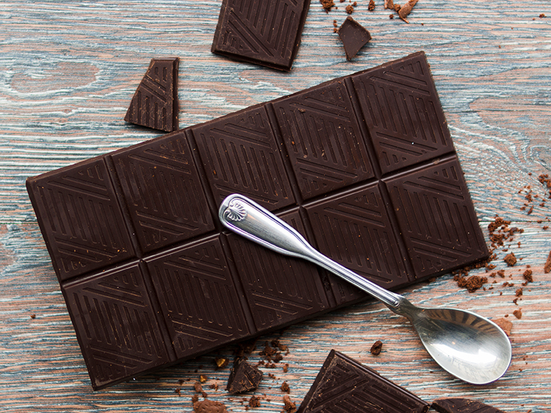 A bar of dark chocolate with high cocoa content, rich in antioxidants