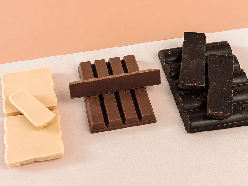 White, milk, and dark chocolate bars side by side
