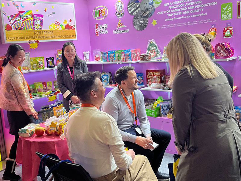 On-site discussions with global clients at ISM Cologne candy trade fair.